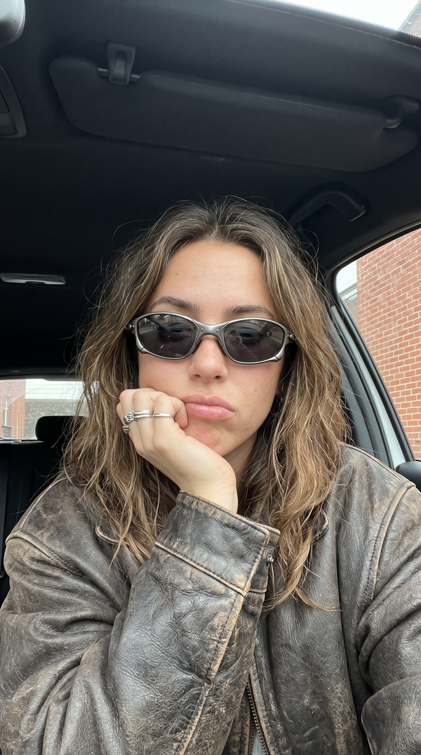 Person wearing ALLOY metal sunglasses with smoke lenses in a car