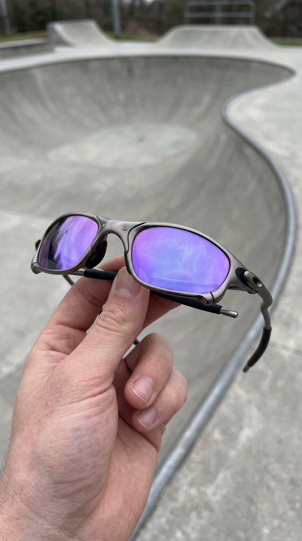 ALLOY metal sunglasses with purple mirror lenses at a skate park